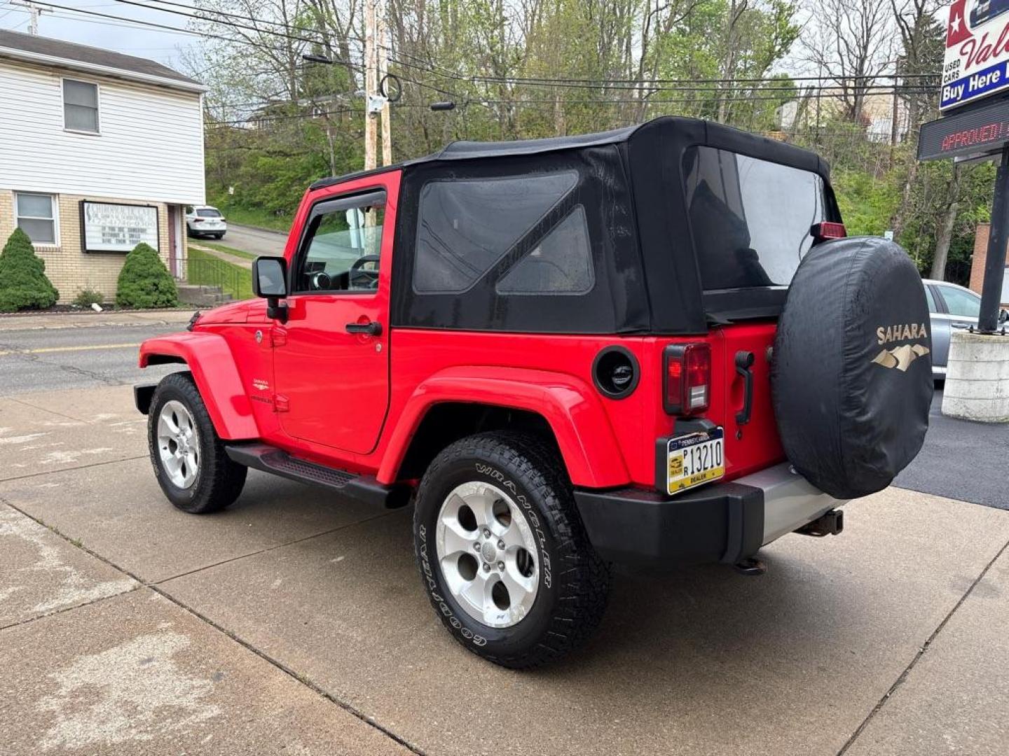 2013 RED JEEP WRANGLER SAHARA (1C4AJWBG4DL) with an 3.6L engine, Automatic transmission, located at 503 First Street, Canonsburg, PA, 15317, (724) 745-0566, 40.266006, -80.178413 - * BRIGHT RED * ONE OWNER * CLEAN CARFAX * LEATHER INTERIOR * AUTOMATIC * 4WD * SAHARA PACKAGE * 3.6L V6 * ONLY 48K MILES If you've been searching for a clean, low-mileage Wrangler, this is the one! Hard to find condition with only 48k miles. Its ready for summer cruising or weekend adven - Photo#2