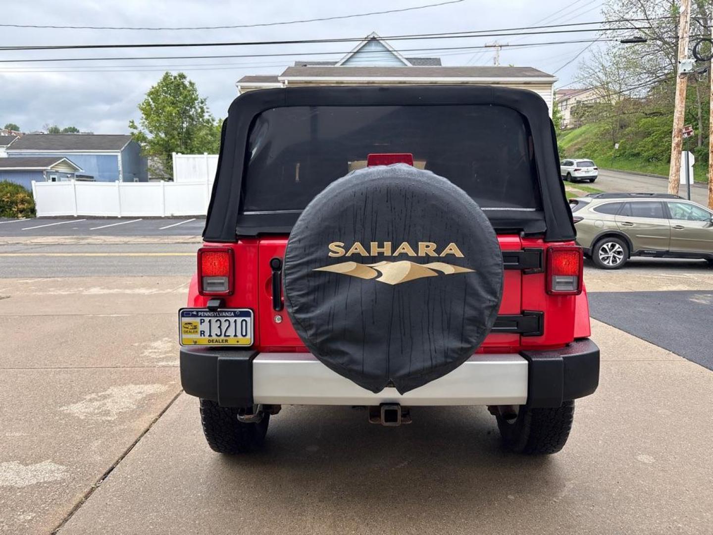 2013 RED JEEP WRANGLER SAHARA (1C4AJWBG4DL) with an 3.6L engine, Automatic transmission, located at 503 First Street, Canonsburg, PA, 15317, (724) 745-0566, 40.266006, -80.178413 - * BRIGHT RED * ONE OWNER * CLEAN CARFAX * LEATHER INTERIOR * AUTOMATIC * 4WD * SAHARA PACKAGE * 3.6L V6 * ONLY 48K MILES If you've been searching for a clean, low-mileage Wrangler, this is the one! Hard to find condition with only 48k miles. Its ready for summer cruising or weekend adven - Photo#3