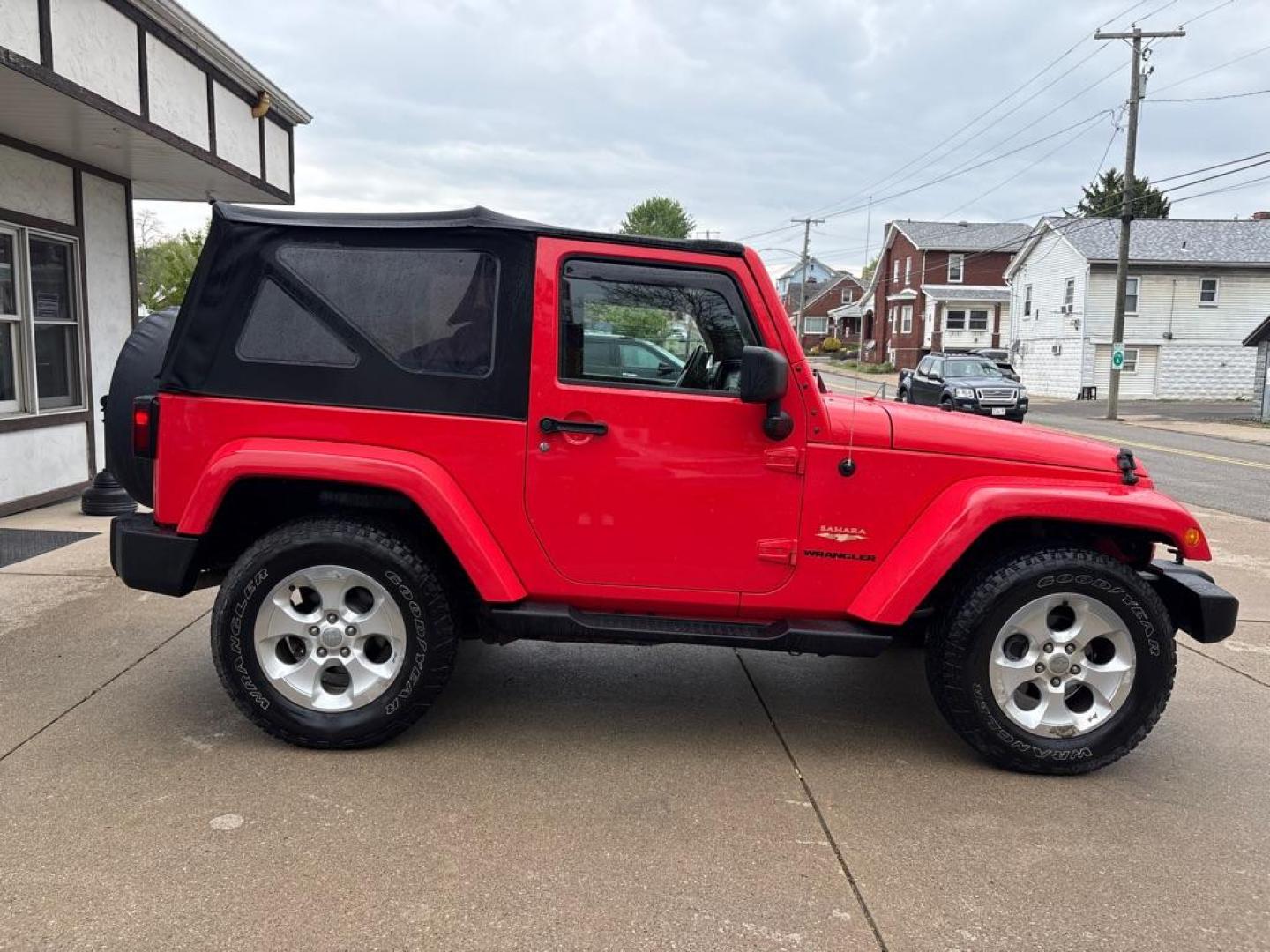 2013 RED JEEP WRANGLER SAHARA (1C4AJWBG4DL) with an 3.6L engine, Automatic transmission, located at 503 First Street, Canonsburg, PA, 15317, (724) 745-0566, 40.266006, -80.178413 - * BRIGHT RED * ONE OWNER * CLEAN CARFAX * LEATHER INTERIOR * AUTOMATIC * 4WD * SAHARA PACKAGE * 3.6L V6 * ONLY 48K MILES If you've been searching for a clean, low-mileage Wrangler, this is the one! Hard to find condition with only 48k miles. Its ready for summer cruising or weekend adven - Photo#5