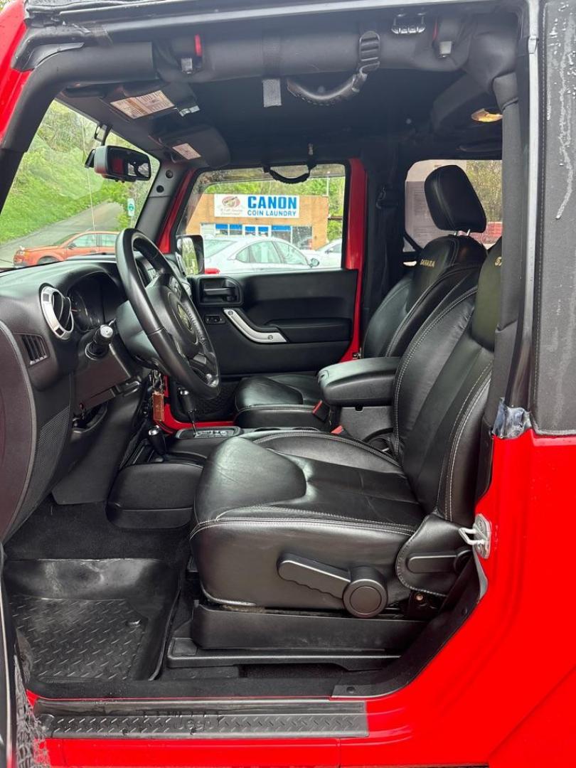 2013 RED JEEP WRANGLER SAHARA (1C4AJWBG4DL) with an 3.6L engine, Automatic transmission, located at 503 First Street, Canonsburg, PA, 15317, (724) 745-0566, 40.266006, -80.178413 - * BRIGHT RED * ONE OWNER * CLEAN CARFAX * LEATHER INTERIOR * AUTOMATIC * 4WD * SAHARA PACKAGE * 3.6L V6 * ONLY 48K MILES If you've been searching for a clean, low-mileage Wrangler, this is the one! Hard to find condition with only 48k miles. Its ready for summer cruising or weekend adven - Photo#18