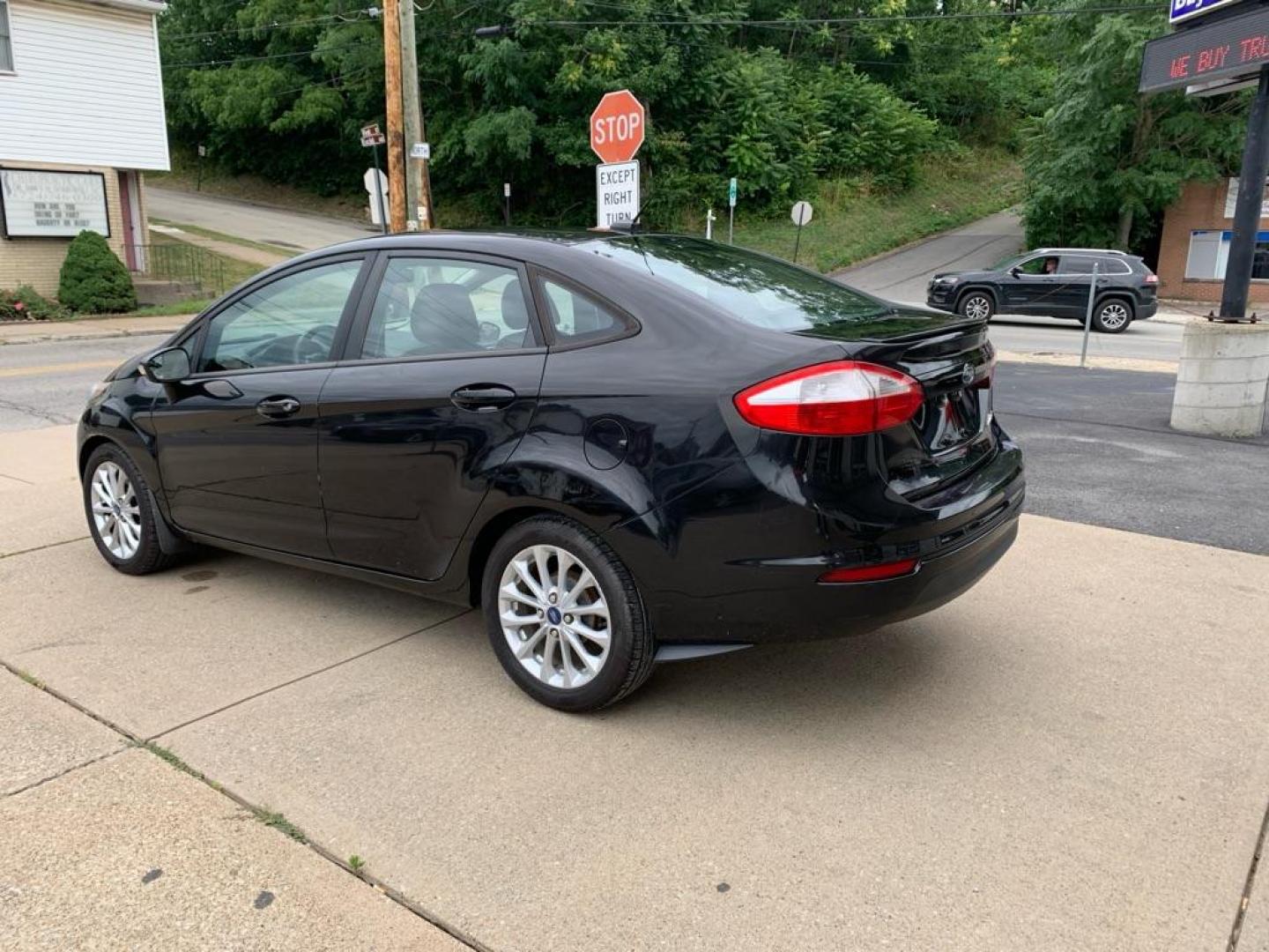 2014 BLACK FORD FIESTA SE (3FADP4BJ7EM) with an 1.6L engine, Automatic transmission, located at 503 First Street, Canonsburg, PA, 15317, (724) 745-0566, 40.266006, -80.178413 - Photo#2